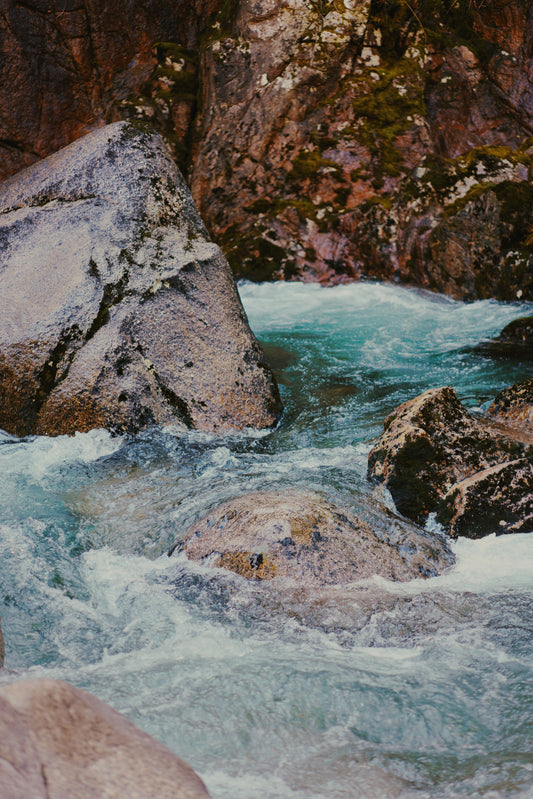 Close-up of flowing water representing hydration and water-based hair care