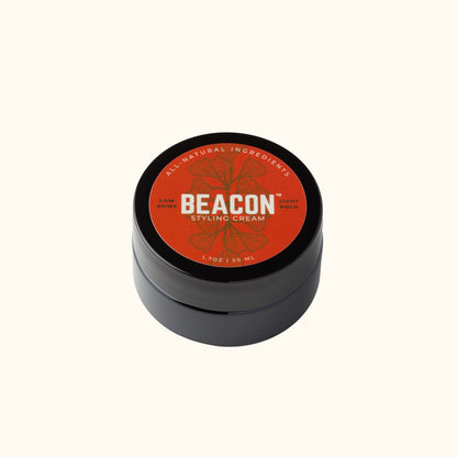 Beacon Styling Cream in glossy black jar with orange label, light hold water-based hair cream for men and women with natural shine.